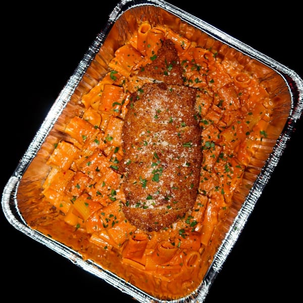 Nunzi's rigatoni with vodka sauce, topped with a breaded chicken cutlet, parmesan, and parsley.
